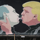 A mural depicts U.S. President Donald Trump (right) blowing marijuana smoke into the mouth of Russian President Vladimir Putin on the wall of a barbecue restaurant on Nov. 23, 2016, in Vilnius, Lithuania. (Sean Gallup/Getty Images)